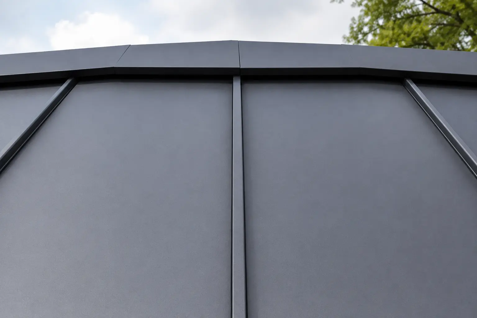 Close-up detail of clean standing seam metal roof panels on a residential roof.