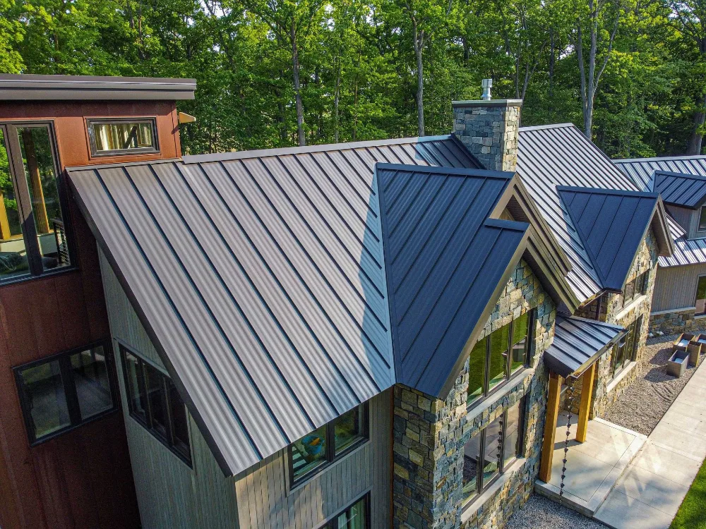 Aerial view of a Michigan home with a standing seam metal roof