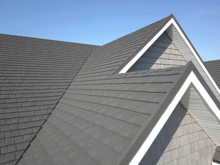 Wide-angle view of a dark gray stone-coated steel shingle roof, Tilcor CF Shingle style